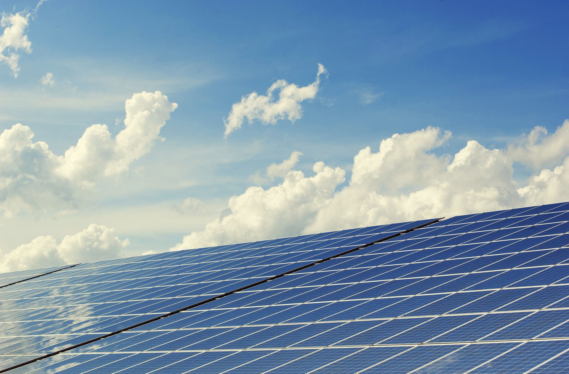 Solar panels against a blue sky, solar PV supplies, Cheshire